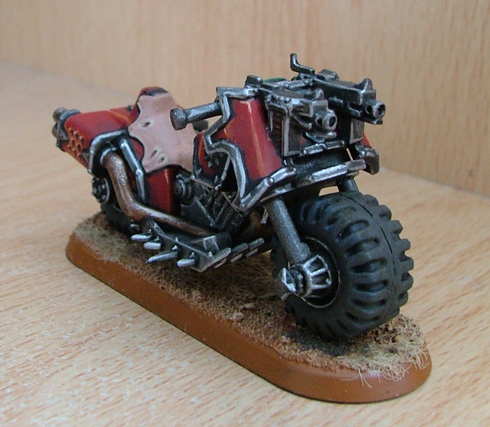 A finished bike sits on a base like the one shown in the article.