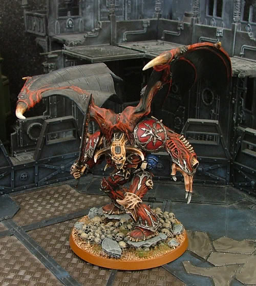 ...whilst this Daemon prince stands astride the many skulls of the fallen!
